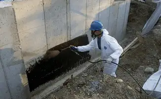 Professional waterproofing the exterior walls of the basement in Jacksonville, FL